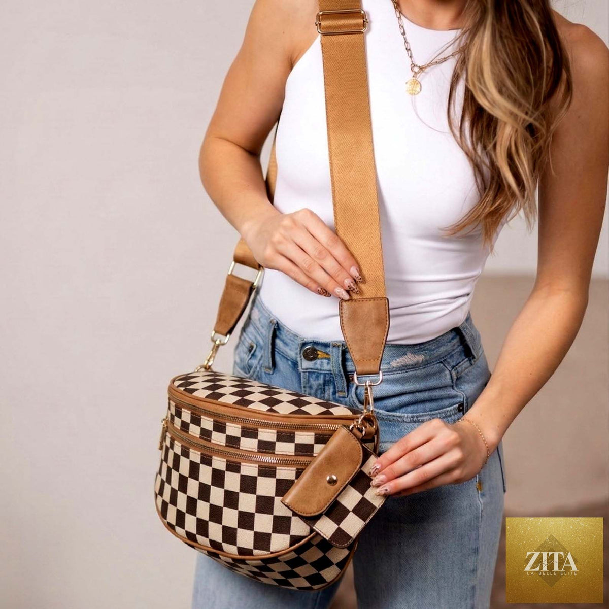Aili's Corner Kaylee mixed media double zip crossbody sling bag in cognac color with adjustable strap and multiple compartments.