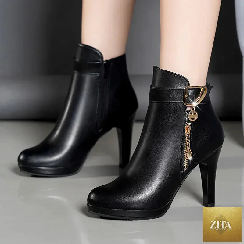 Pair of women's winter ankle boots with chunky heels in black, featuring warm lining and stylish design from Trendy Attic Store01.