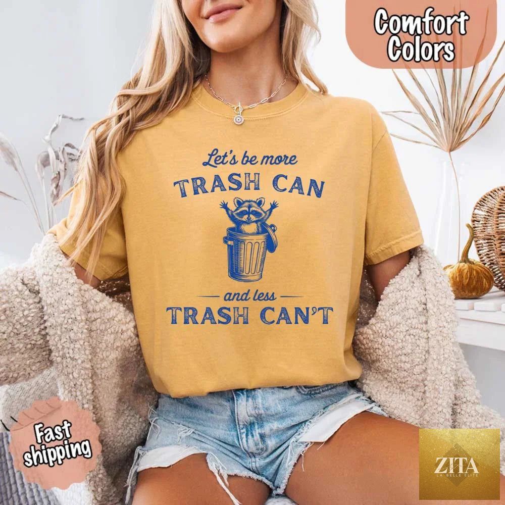 Comfort Colors Let’s Be More Trash Can Raccoon funny T-shirt featuring a raccoon design on a casual cotton tee.
