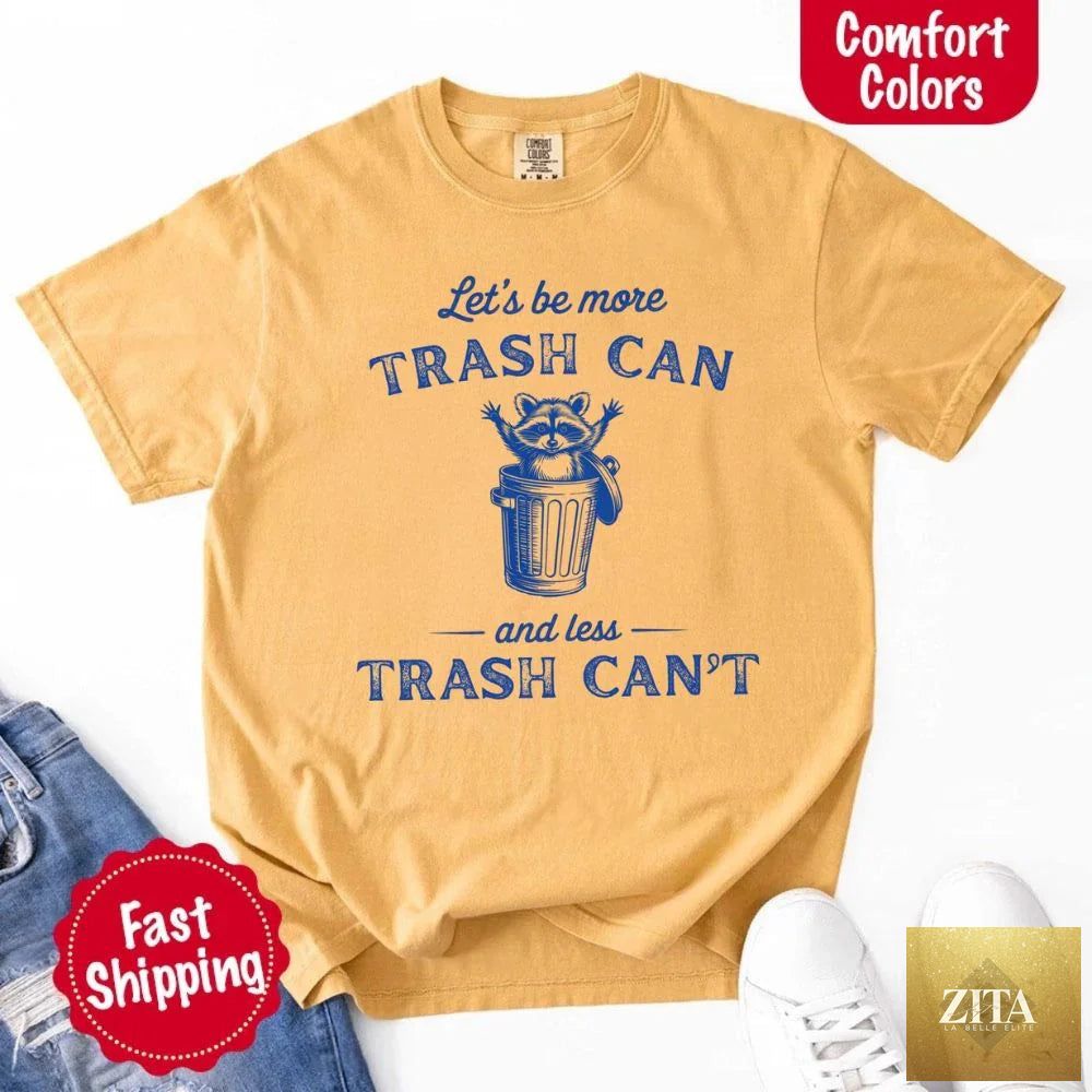 Comfort Colors funny T-shirt featuring a raccoon and trash can design, perfect for casual wear by Adorb Custom Tees.