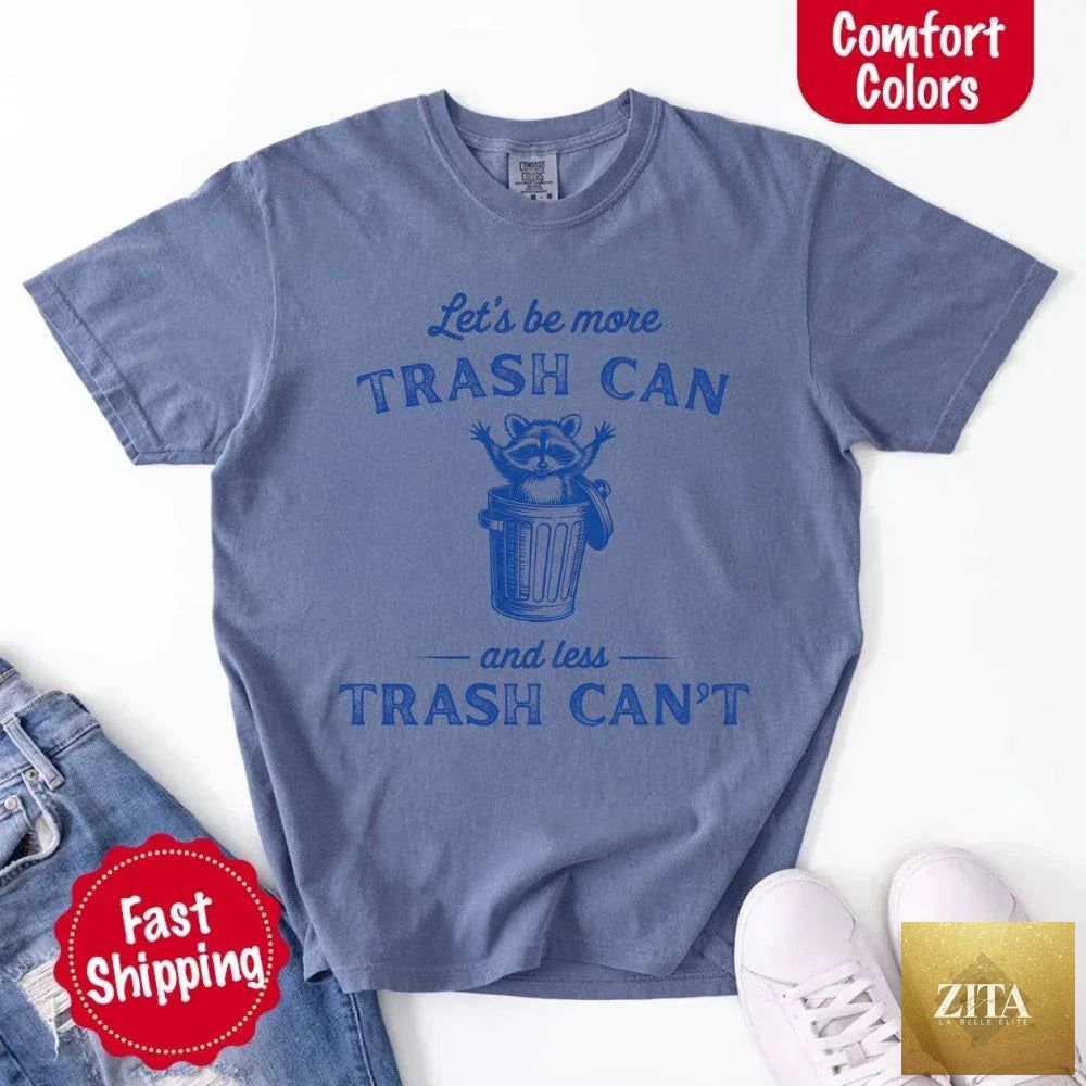 Comfort Colors Let’s Be More Trash Can Raccoon funny T-shirt, featuring a humorous raccoon graphic on a casual T-shirt.
