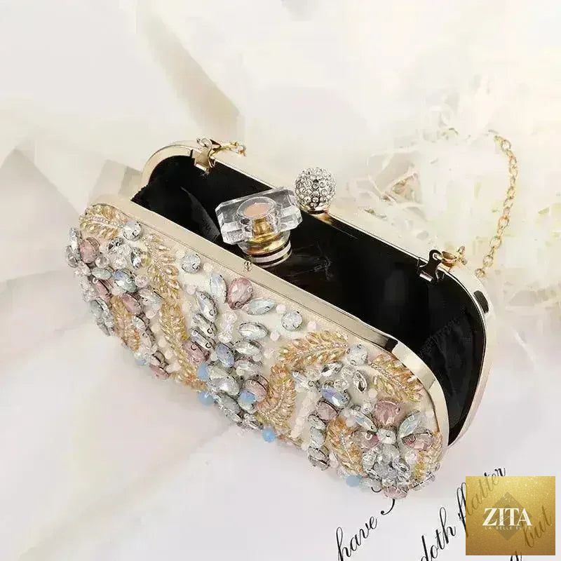 Femstylo luxury rhinestone clutch bag for weddings and parties, crystal adorned purse with chain shoulder strap.