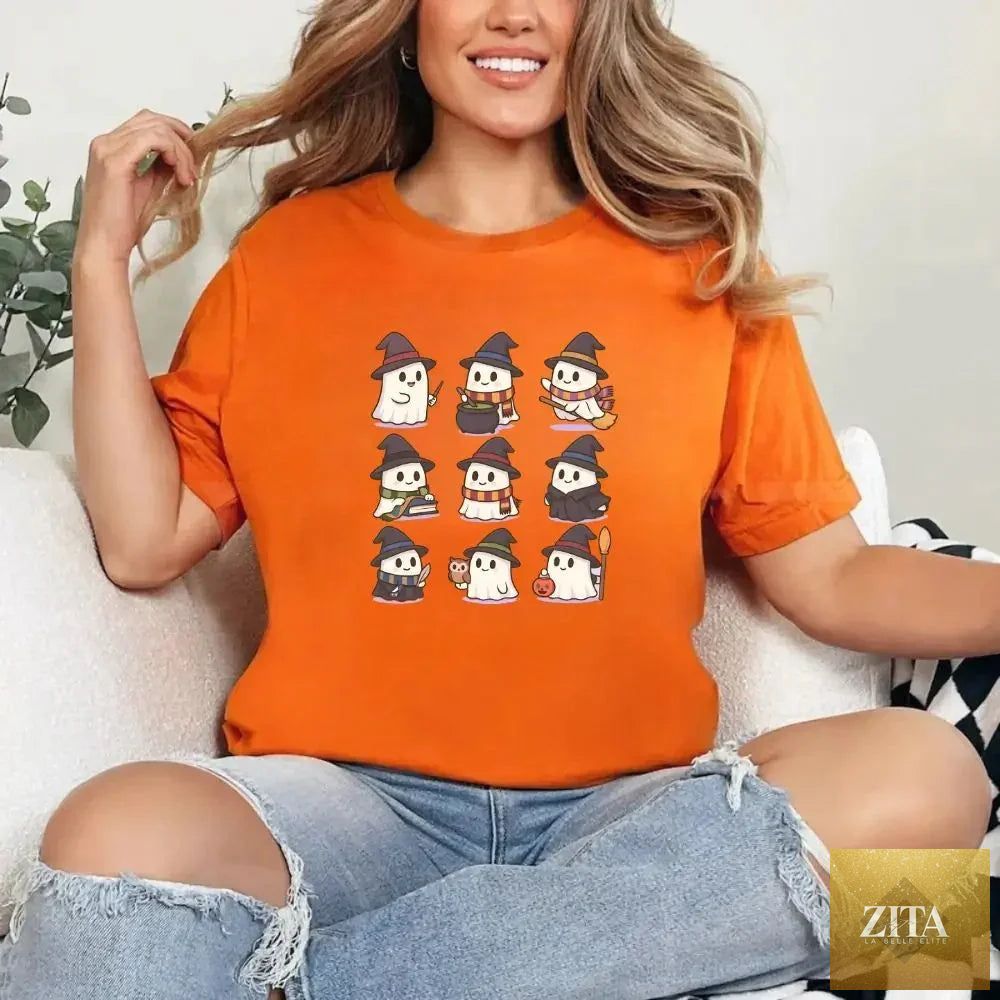 Kawaii Halloween T-shirt featuring cute witch and ghost illustrations, perfect for spooky season, by Adorb Custom Tees.