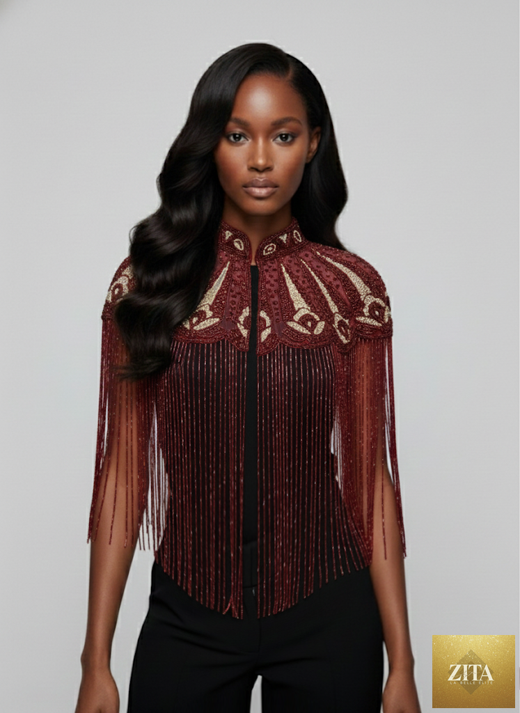 L'Jai Amor Cherry Peacock Cape featuring vibrant cherry and peacock feather patterns with flowing fabric.