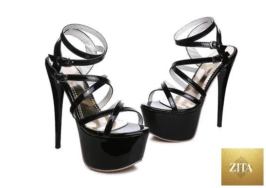 Women’s strappy high heels with stiletto design, black leather, and ankle straps, showcasing stylish footwear from Trendy Attic Store01.