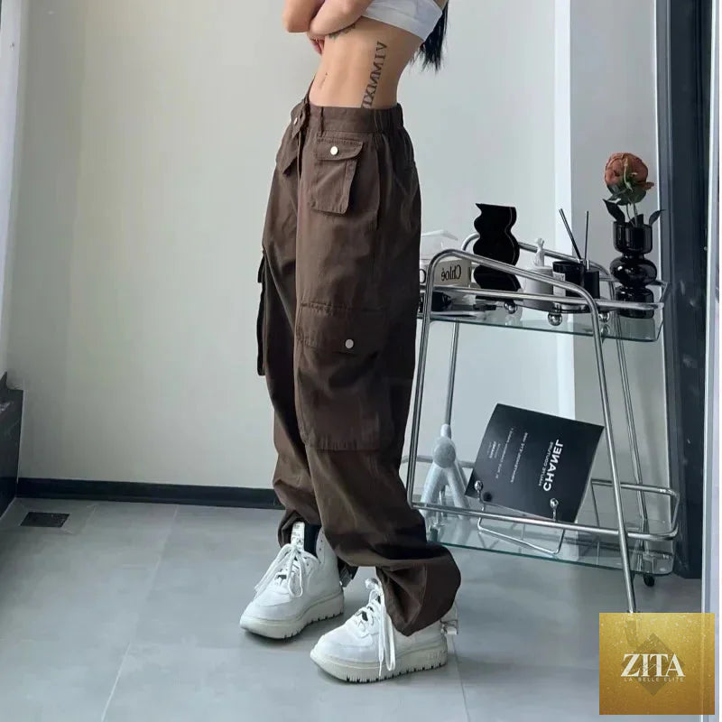 Brown vintage cargo pants for women featuring a baggy, streetwear style with a casual, 90s aesthetic and hippie-inspired details.