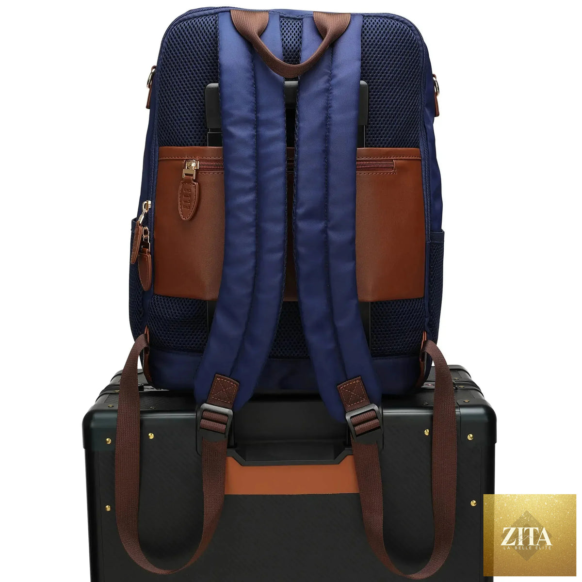 Navy Luxe Journey 18L twill and vegan leather backpack by Travellty with trolley passthrough and multiple compartments.