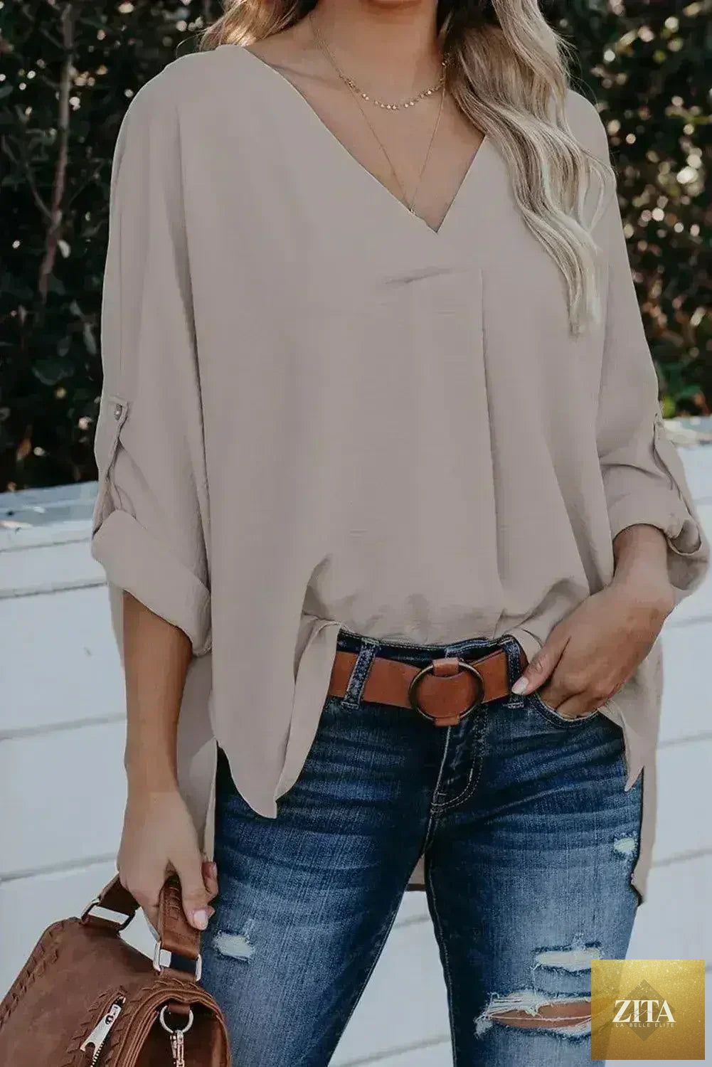 Elegant apricot V-neck blouse with 3/4 sleeves and a high-low hem, from Femstylo's collection of stylish tops and blouses.