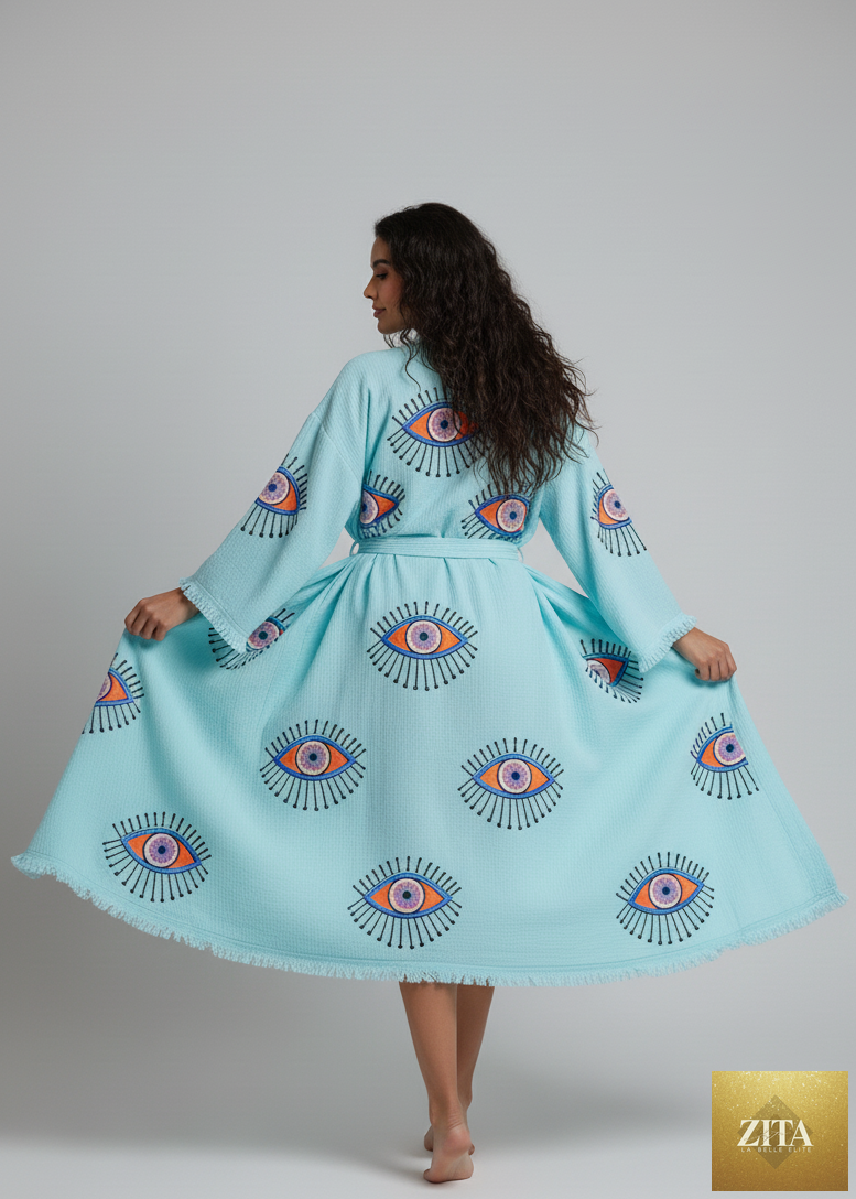 Turquoise Evil Eye hand printed kimono by Zita La Belle Elite, showcasing intricate design and flowing fabric.