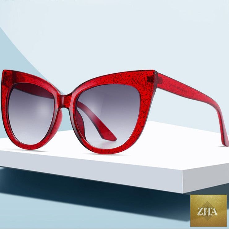 Women's oversized cat eye sunglasses by FitiqueFit with UV400 protection, featuring black frames and tinted lenses.