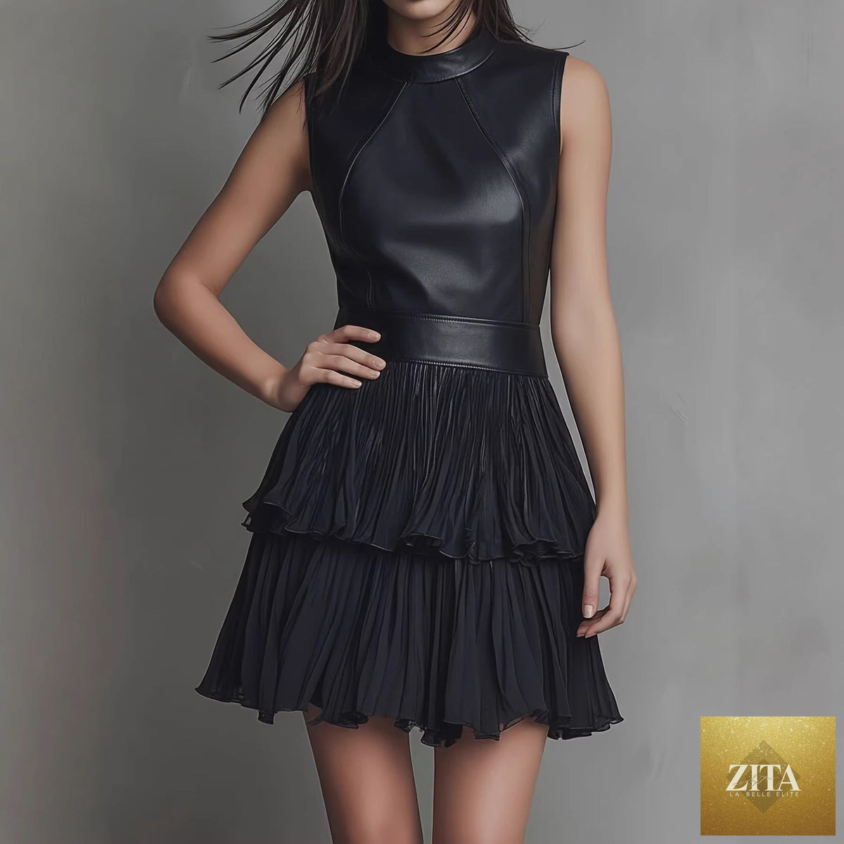 Black PU leather spliced mini dress by FitiqueFit with sleeveless design and double-layer ruffle hem, styled for a chic look.