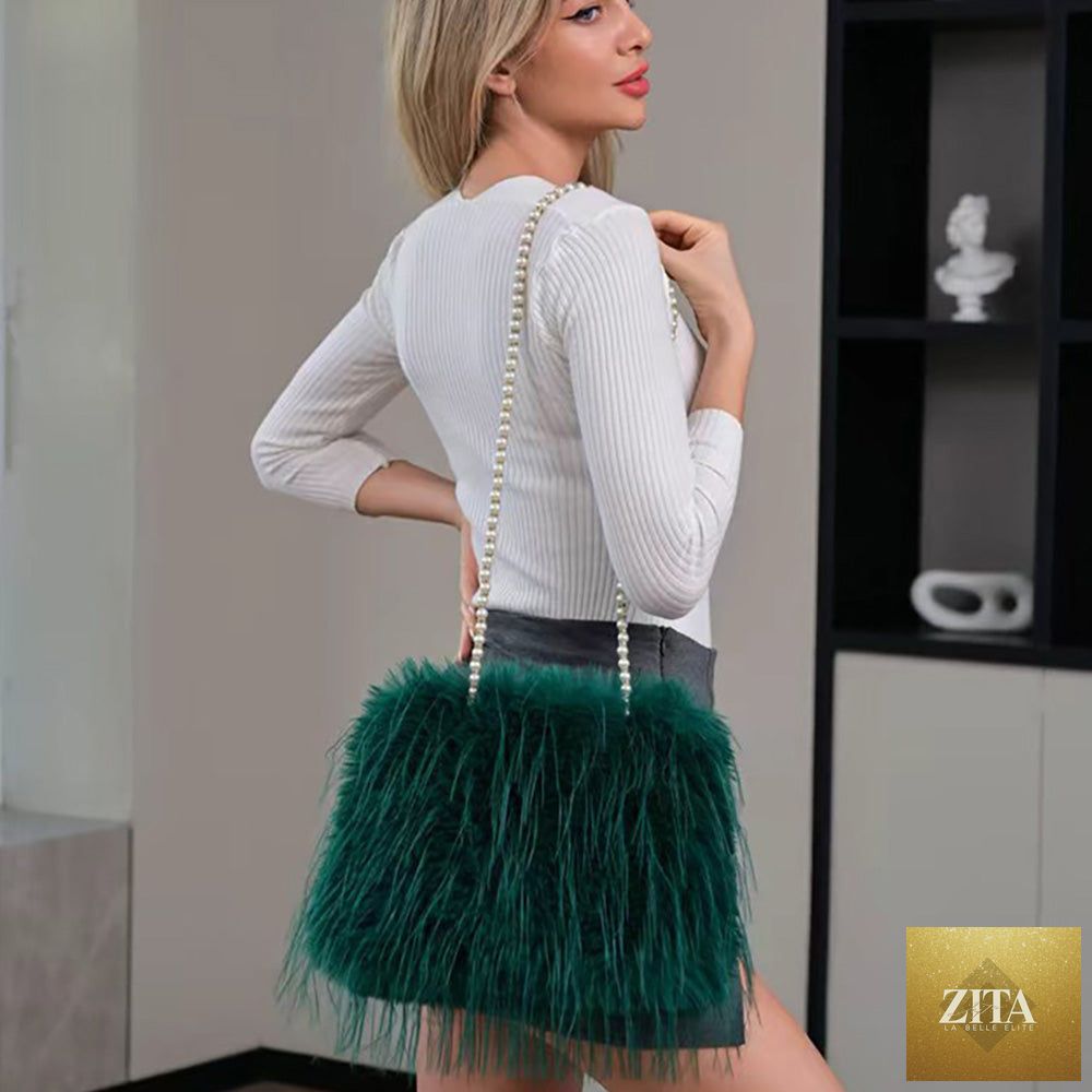 Green fluffy faux fur shoulder bag with pearl strap from Madeline Love, featuring a soft, plush texture and stylish design.