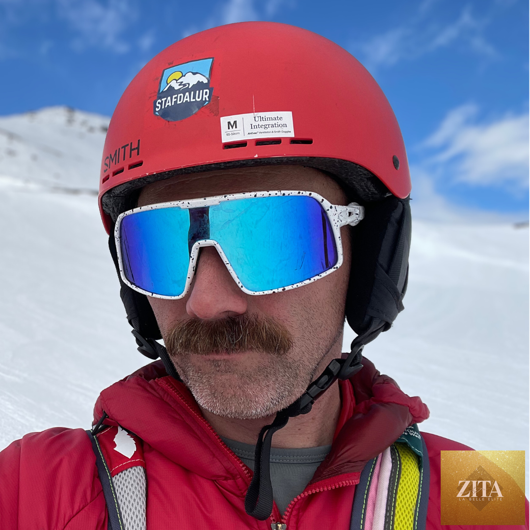 Flying Dog sunglasses with blue-mirror Revo lenses by Eastern Outer, featuring a sleek matte helmet design.