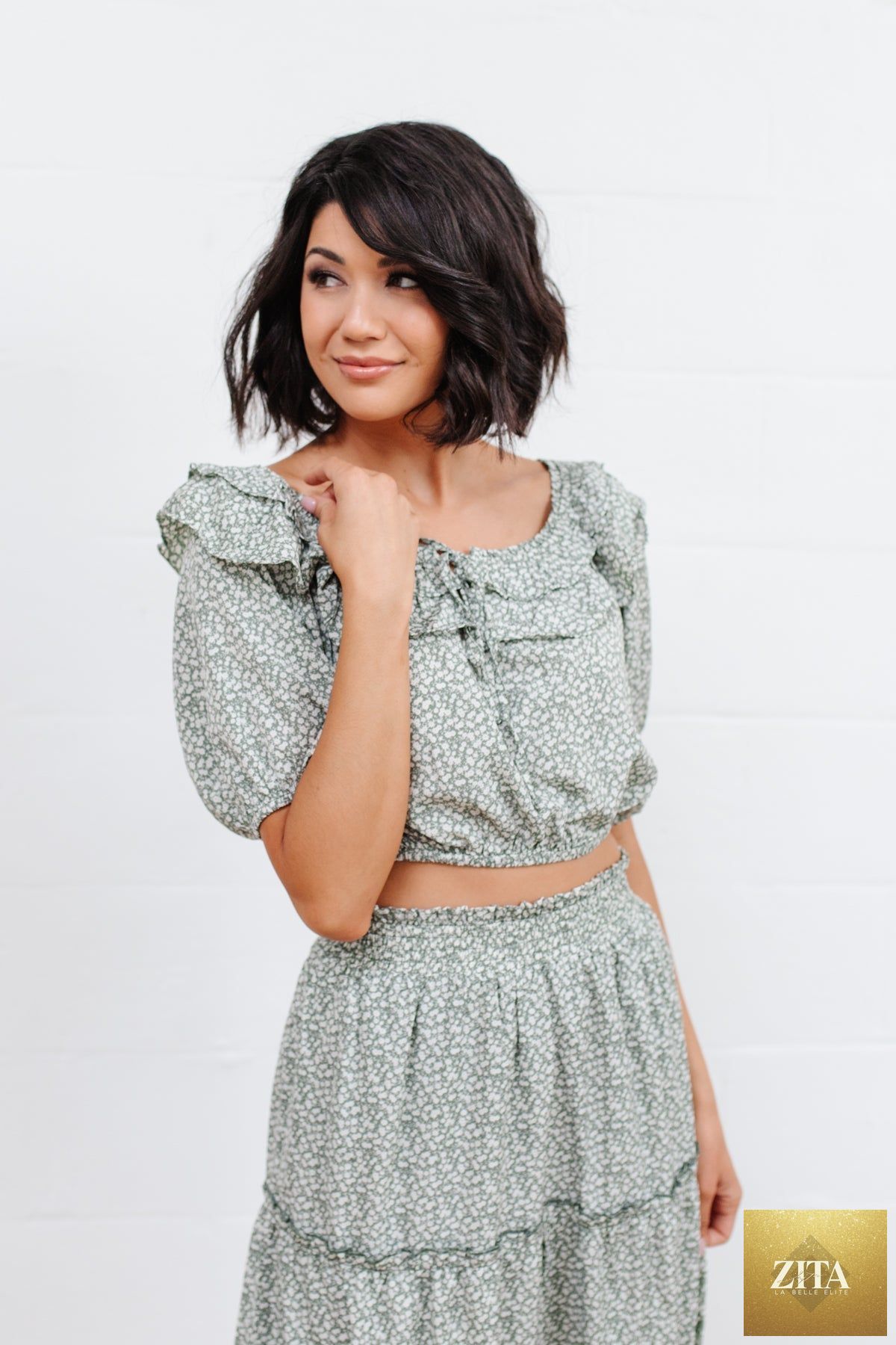 Women's Golden Hour Top in Sage by Thread & Co. Boutique, LLC, shown in a relaxed fit with short sleeves and a V-neck design.