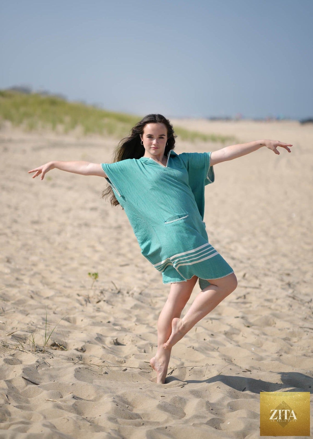 Green Zita La Belle Elite beach cover-up poncho with hood, lightweight and stylish for beach or poolside wear.