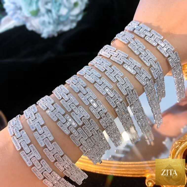 Women's diamond iced out 18K gold chain bracelet featuring a charm design, crafted by donjohnbyvictoriacharles.