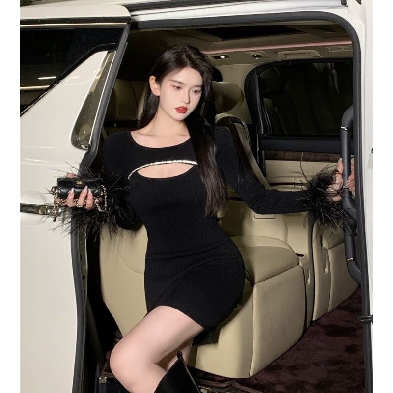 Black party dress with ostrich feather details from donjohnbyvictoriacharles, elegant women's dress for special occasions.