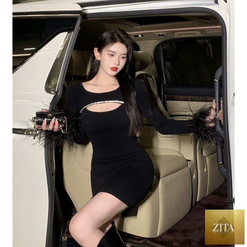 Black party dress with ostrich feather details by Zita La Belle Elite, showcasing a stylish women's dress with elegant feather accents.
