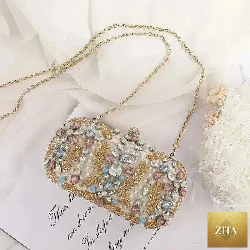 Femstylo luxury rhinestone clutch bag for weddings and parties, elegant handbag with sparkling embellishments.
