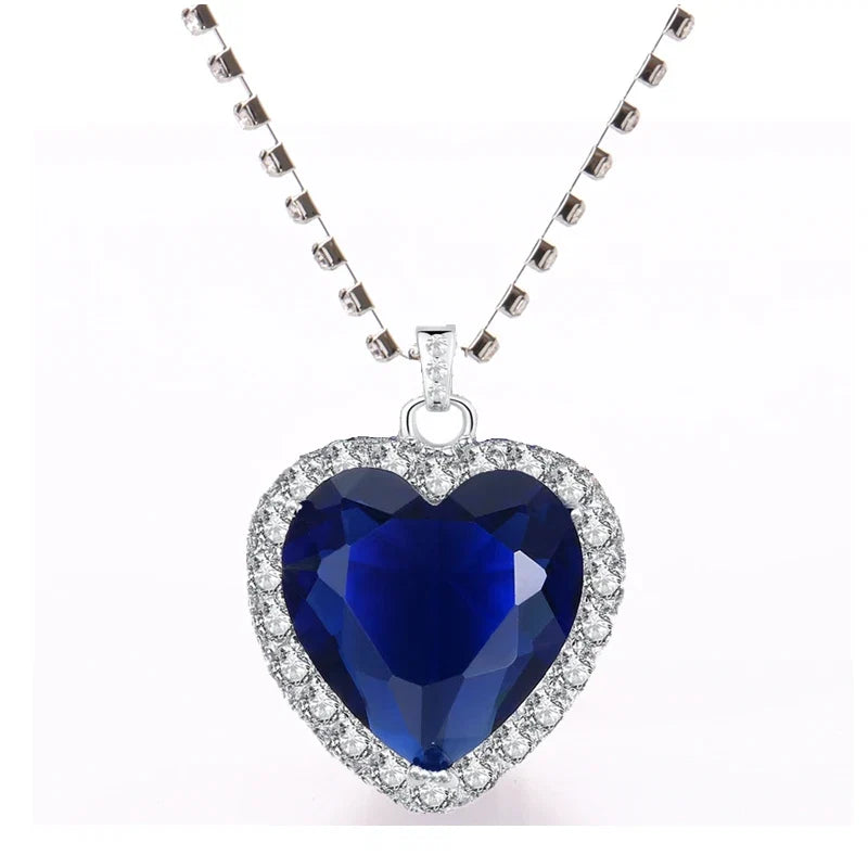 Titanic Heart of Ocean blue pendant necklace by FLIPSTYLEZLLC with a velvet bag, featuring a heart-shaped love design.