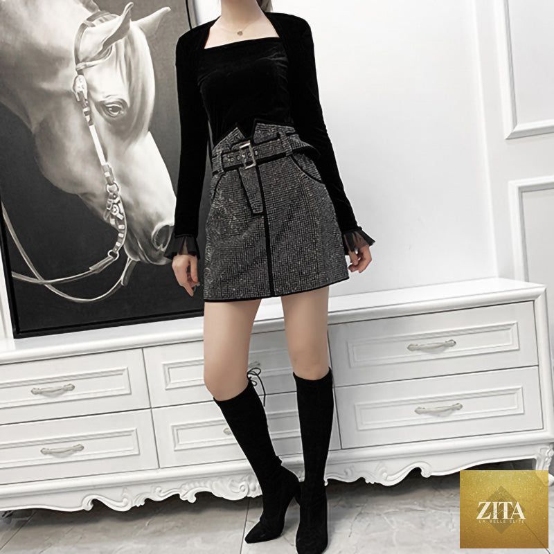 Black sheepskin skirt with rhinestones for women, stylish Zita La Belle Elite fashion item, featuring sparkling embellishments.