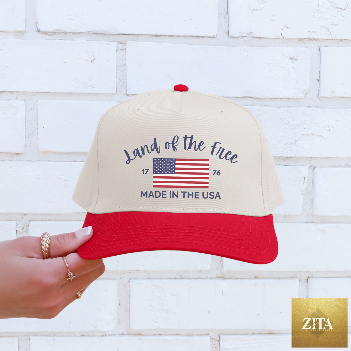 Hey Jude Graphic Tees Land Of The Free Trucker Hat with a mesh back and embroidered front design.