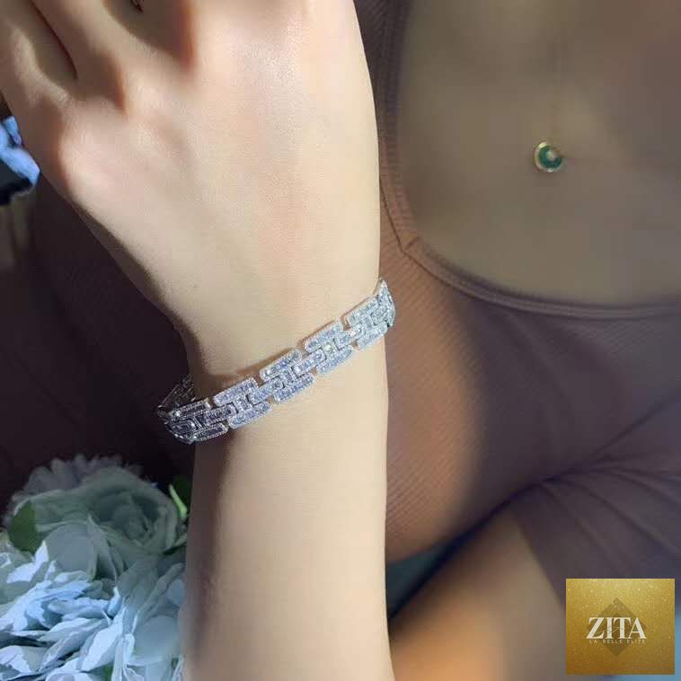 Women's 18K gold diamond chain bracelet with iced out design, featuring a charm from donjohnbyvictoriacharles.