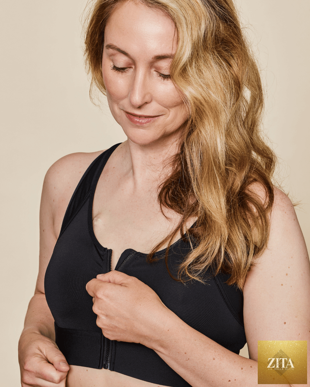 Black Meadow Hero front-closure sports bra with adjustable straps and supportive design, shown from the side view.
