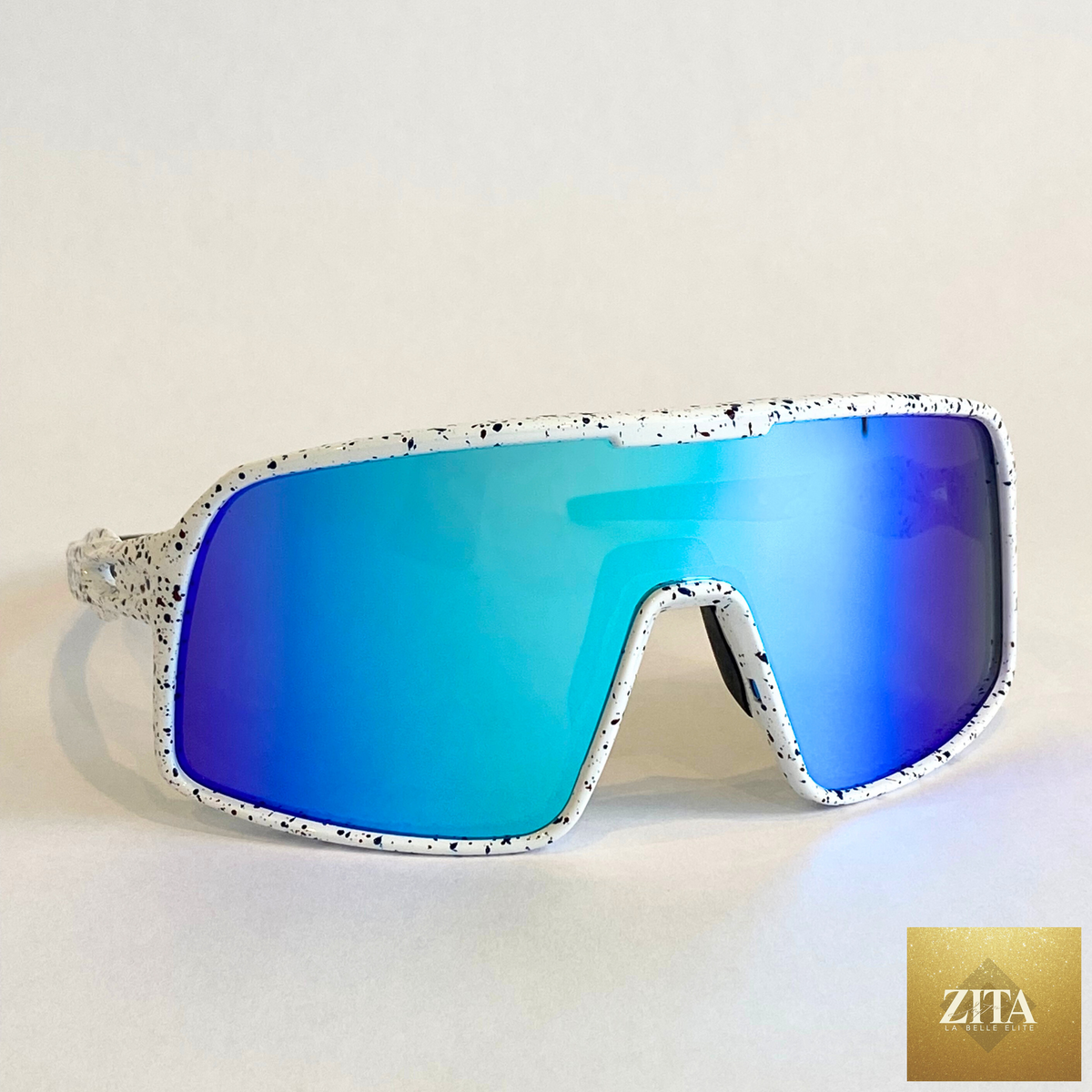 Flying Dog Snowstorm sunglasses with blue-mirror Revo lens by Eastern Outer, shown from a right-angle view.