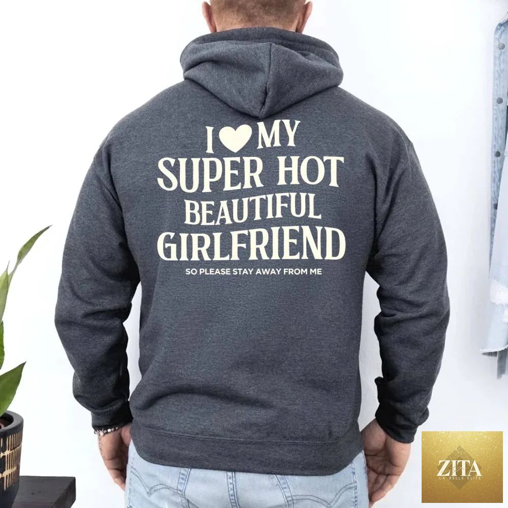 Pink hoodie with "I Love My Super Hot Beautiful Girlfriend" text in bold, casual font, by Adorb Custom Tees.