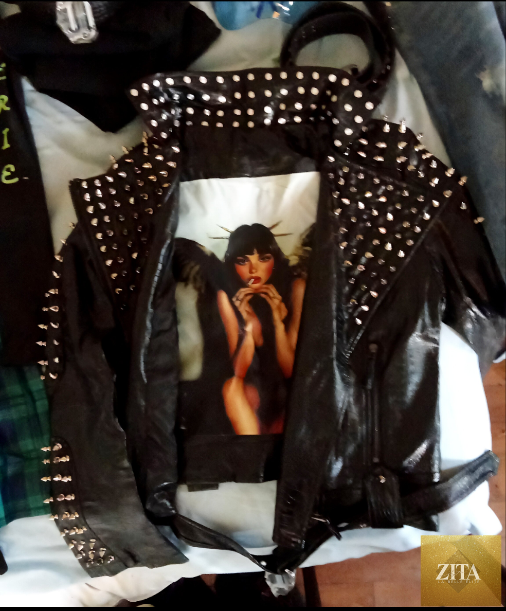 Women's leather jacket by Zita La Belle Elite featuring a sleek black design and stylish collar, displayed on a hanger.