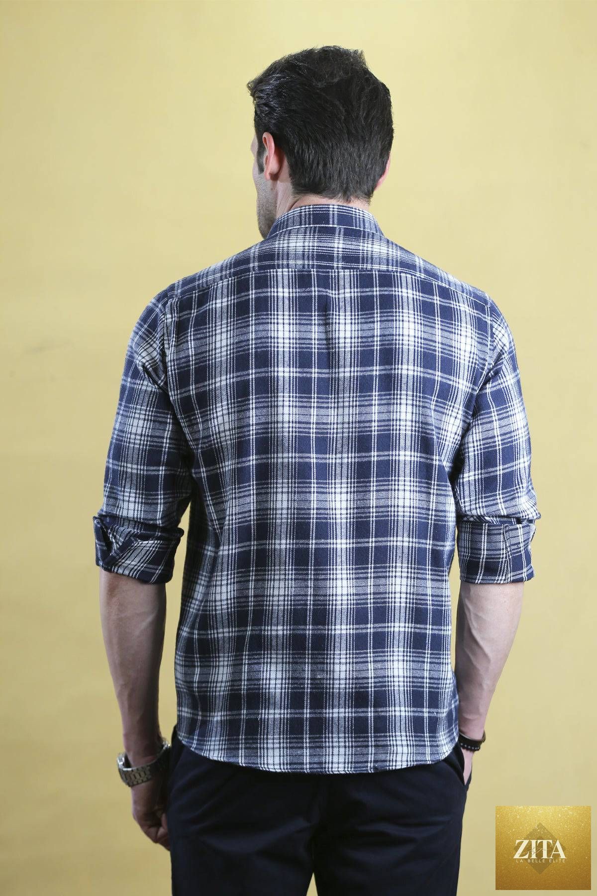 Bright Moons Woodsman Shirt in navy plaid, featuring a classic button-up design with long sleeves and a collar.