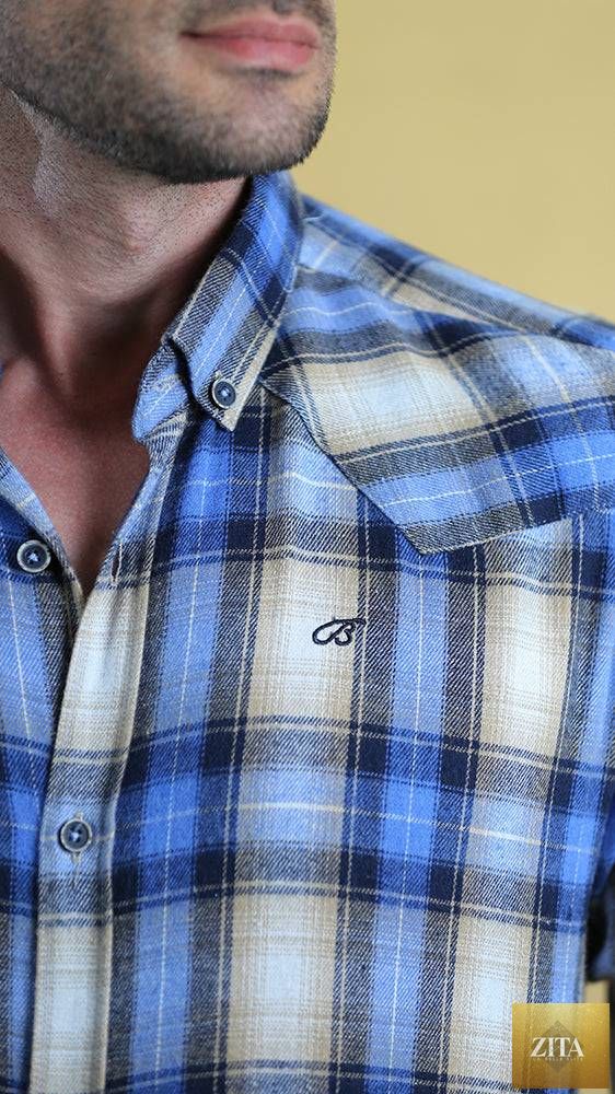 Bright Moons Woodsman shirt displayed on a hanger, featuring rugged fabric and classic outdoor style.