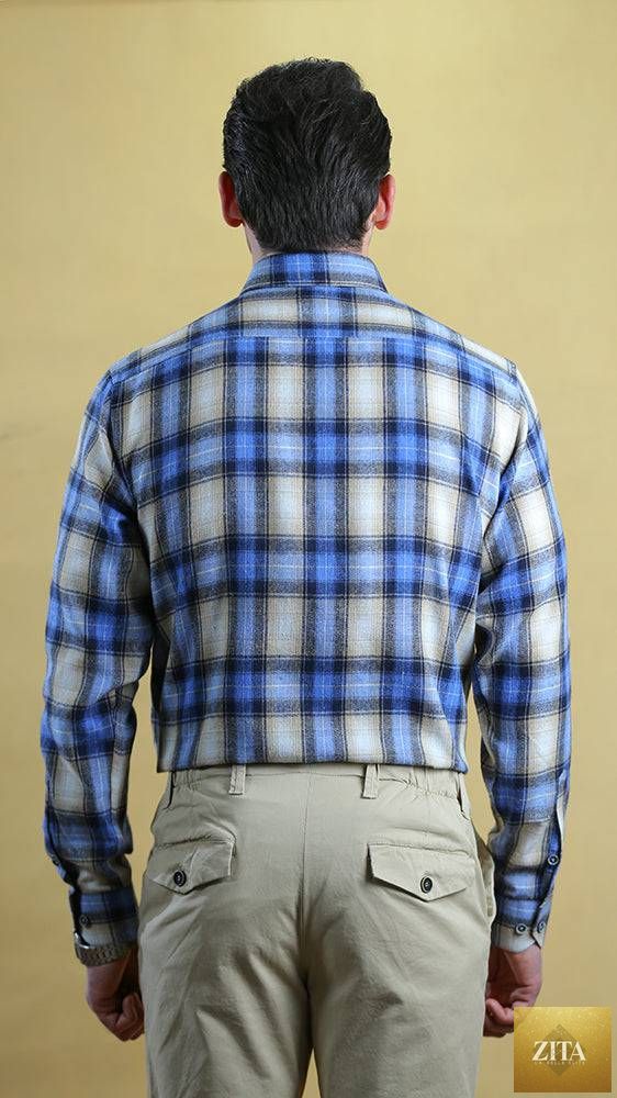 Bright Moons Woodsman Shirt featuring rugged plaid fabric and button-down front, perfect for outdoor or casual wear.