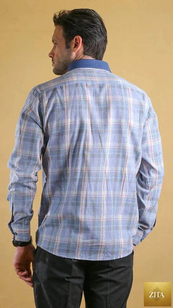 Bright Moons Woodsman Shirt with plaid pattern, button-up front, and chest pockets, displayed on a wooden background.