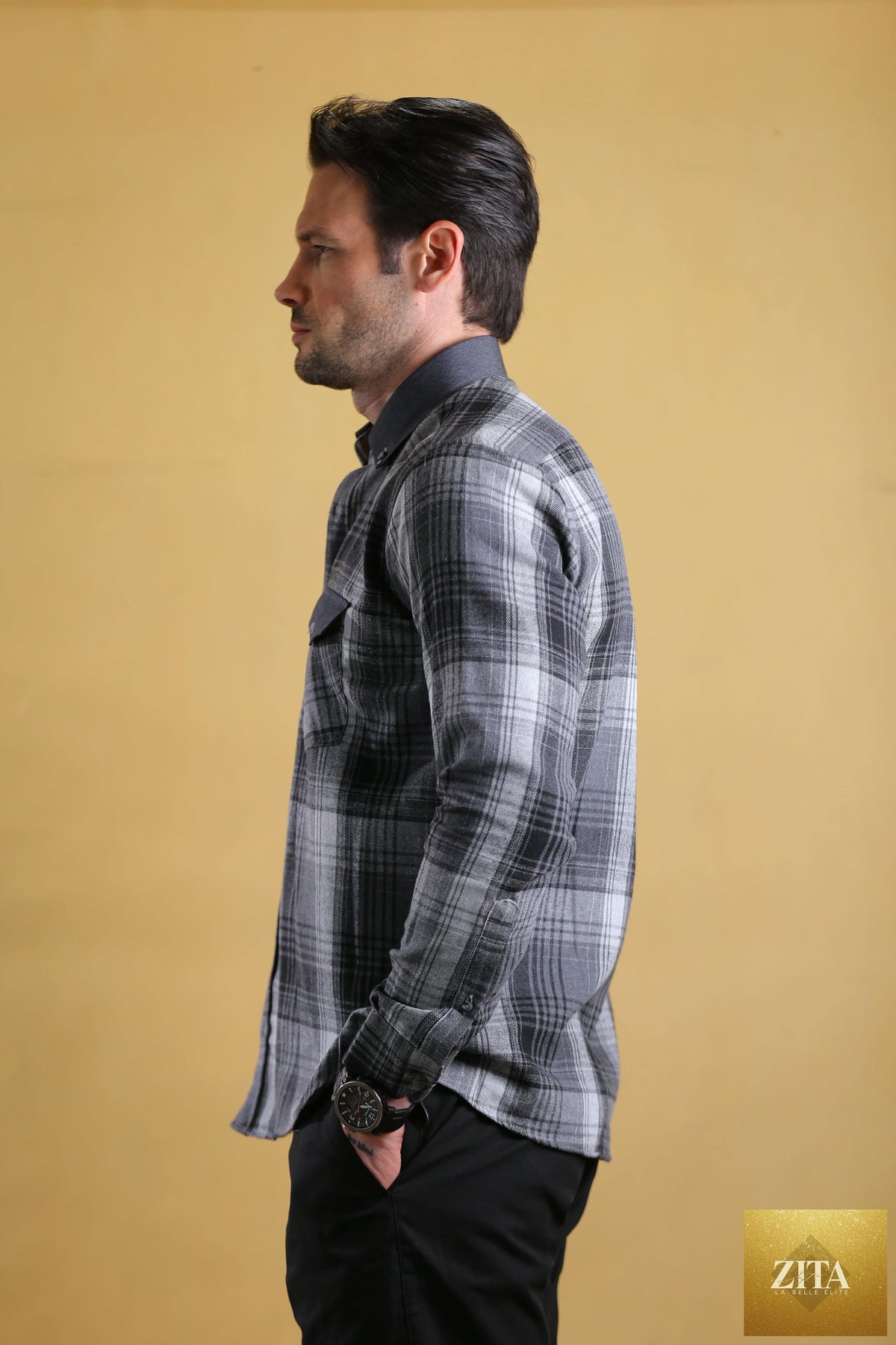 Bright Moons Woodsman Shirt showing a plaid fabric in earthy tones with a collar and button-front design.