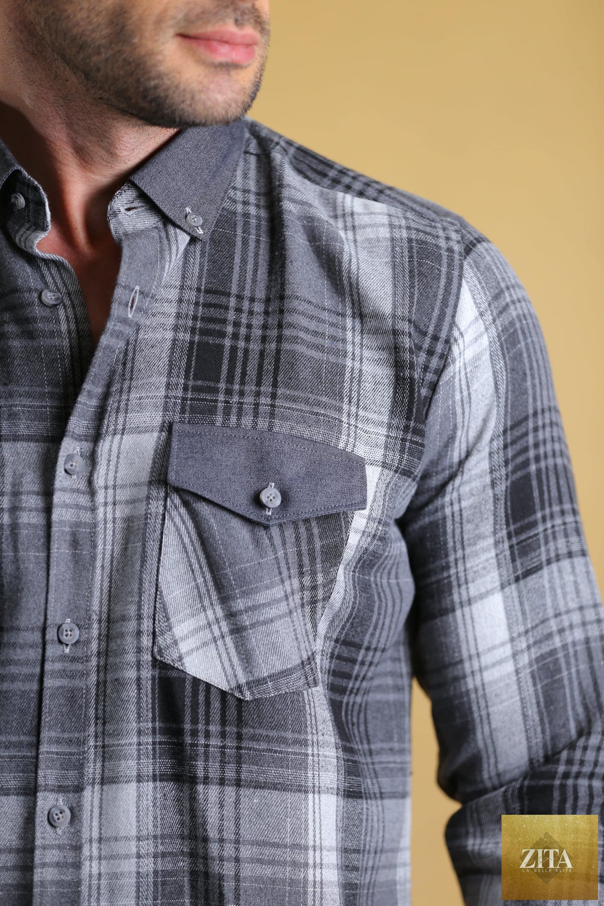 Bright Moons Woodsman Shirt featuring rugged fabric, button-up front, and chest pockets, displayed on a hanger.