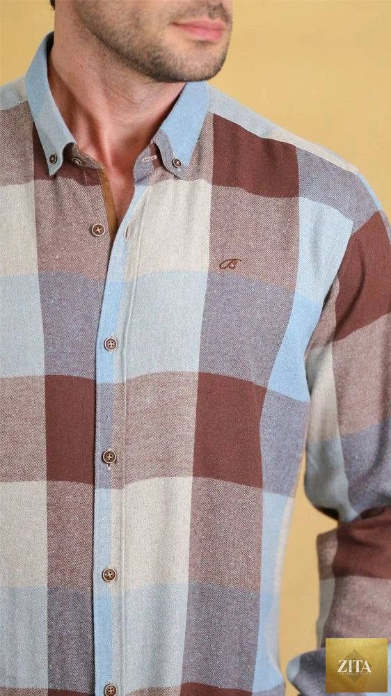 Bright Moons Woodsman Shirt displayed on a hanger, showcasing its rugged design and earthy tones suitable for outdoor style.