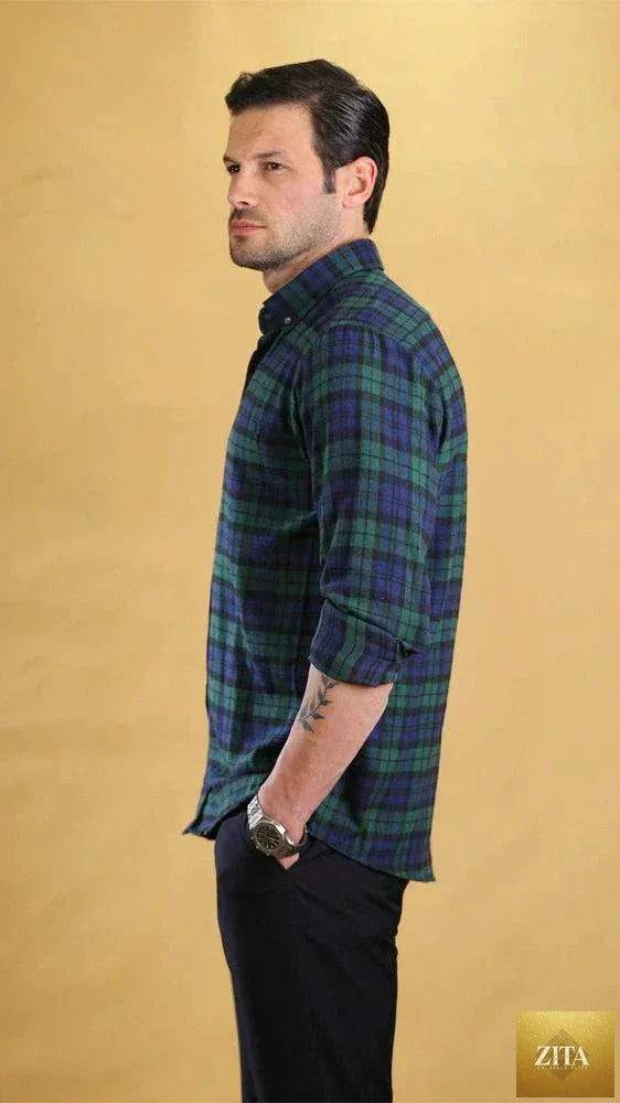 Bright Moons Woodsman Shirt in rugged plaid fabric, featuring button-up front and chest pockets, suitable for outdoor wear.
