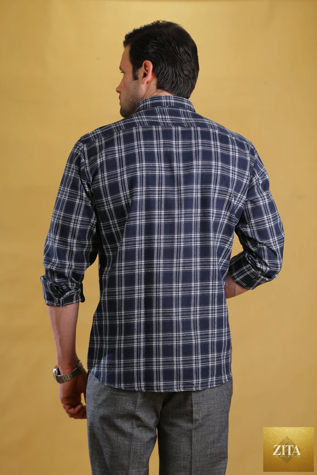 Bright Moons Woodsman Shirt in navy plaid, featuring a classic flannel design with button-up front and chest pockets.