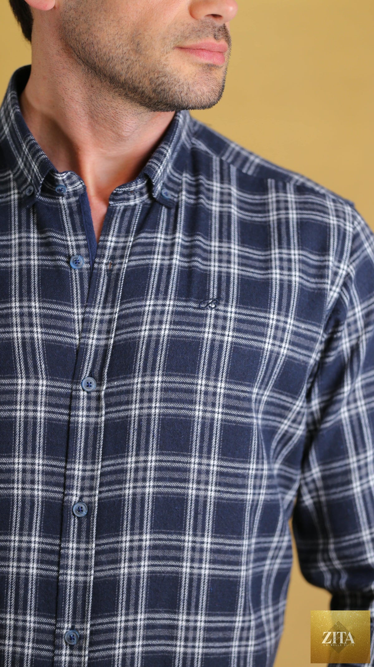 Bright Moons Woodsman Shirt in navy plaid, featuring a classic button-up design with a collar and long sleeves.