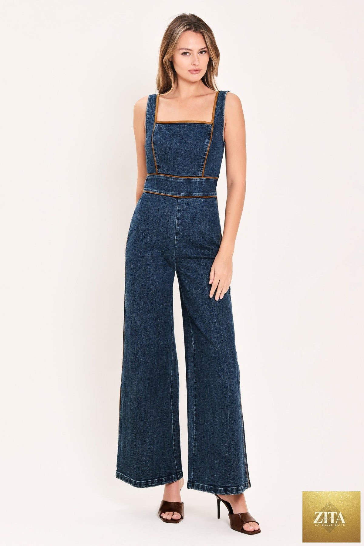 Flying Tomato Western Star Daydream denim jumpsuit in medium indigo, featuring a stylish, casual design with front pockets and adjustable straps.