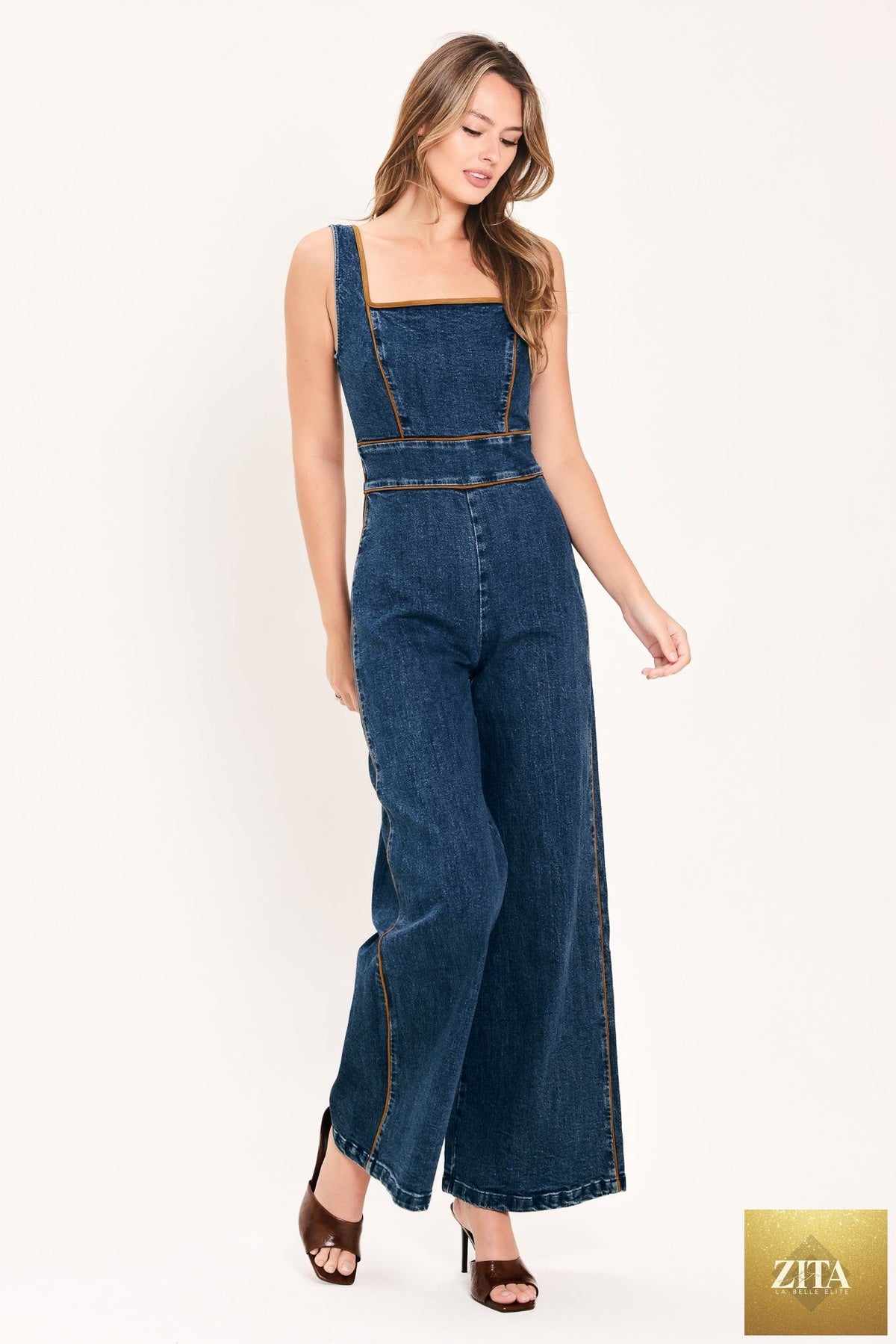 Flying Tomato Western Star Daydream Denim Jumpsuit in medium indigo with a fitted design and adjustable straps.