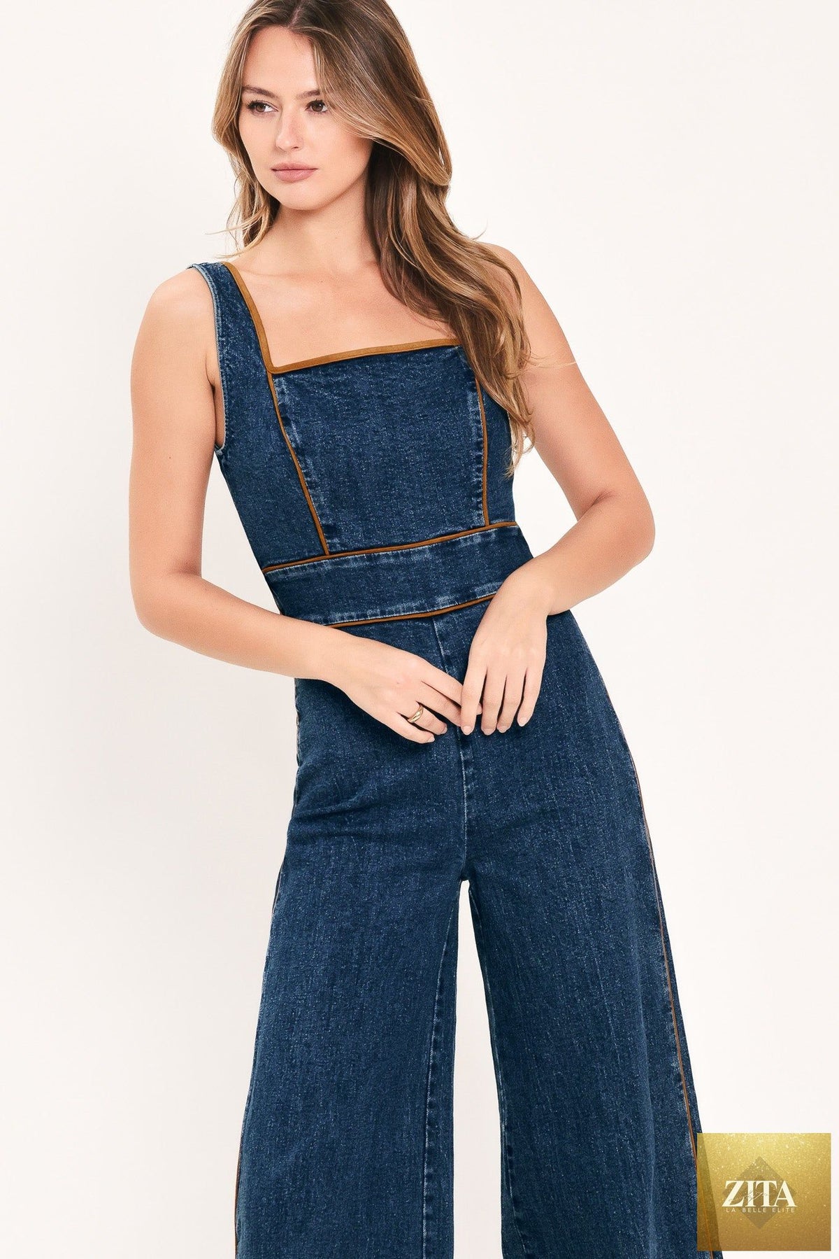 Flying Tomato Western Star Daydream denim jumpsuit in medium indigo, featuring a relaxed fit and stylish design.