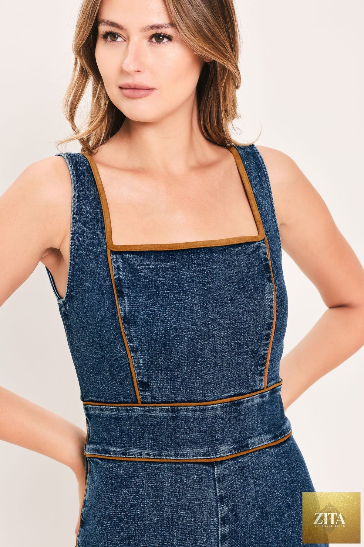 Flying Tomato Western Star Daydream denim jumpsuit in medium indigo with adjustable straps and relaxed fit.