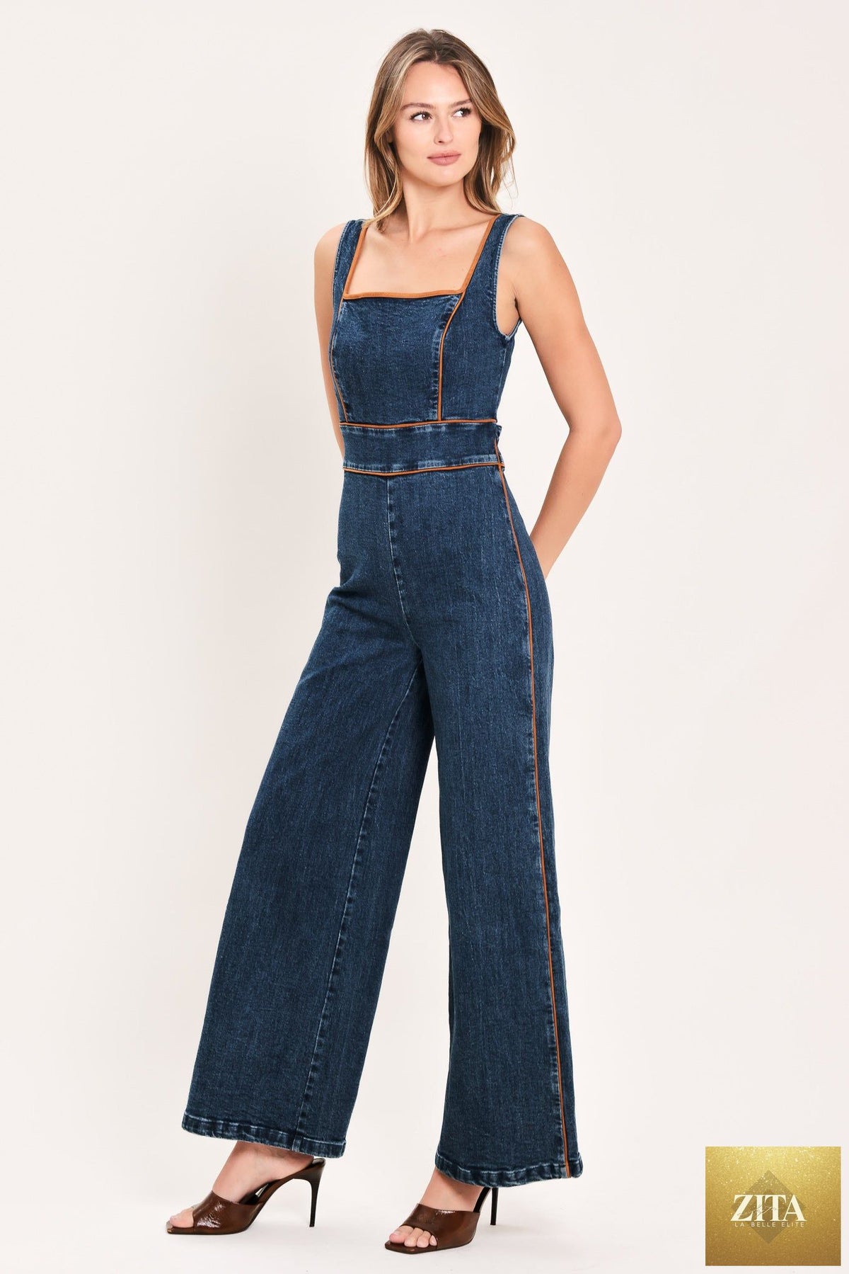 Flying Tomato Western Star Daydream denim jumpsuit in medium indigo, featuring a stylish, fitted design with adjustable straps.