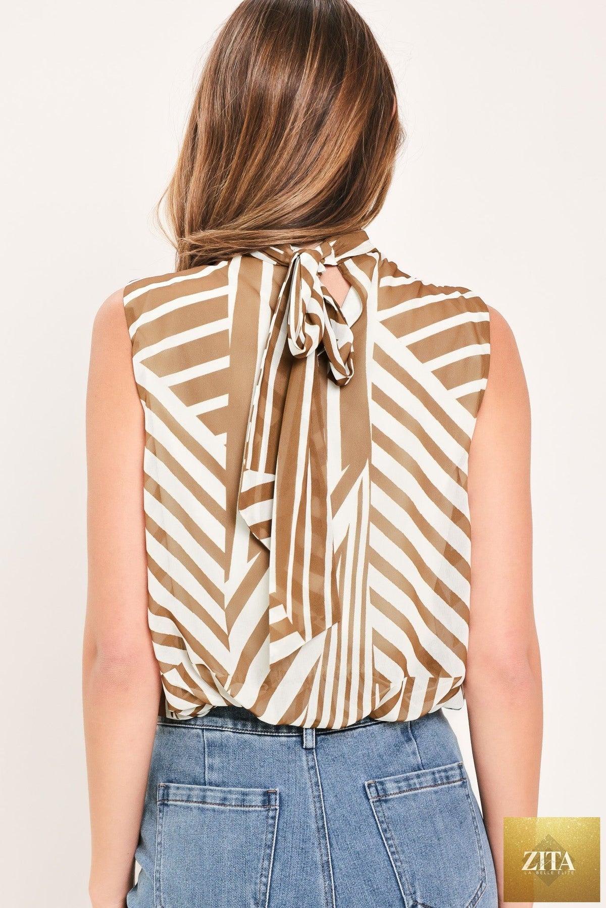 Flying Tomato Latte Ribbon Rhapsody woven top in mocha color, featuring intricate ribbon details and a stylish, comfortable fit.