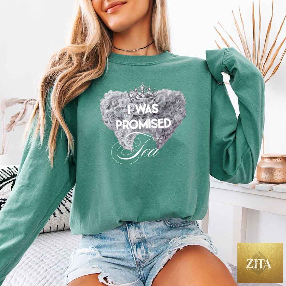 Light green long sleeve T-shirt with "I Was Promised Tea" Comfort Colors branding, styled for BookTok fans by Adorb Custom Tees.