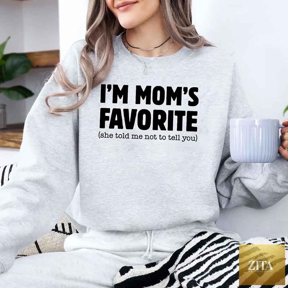 Unisex sweatshirt from Adorb Custom Tees with humorous "I’m Mom’s Favorite" design for son or daughter, casual and comfortable.