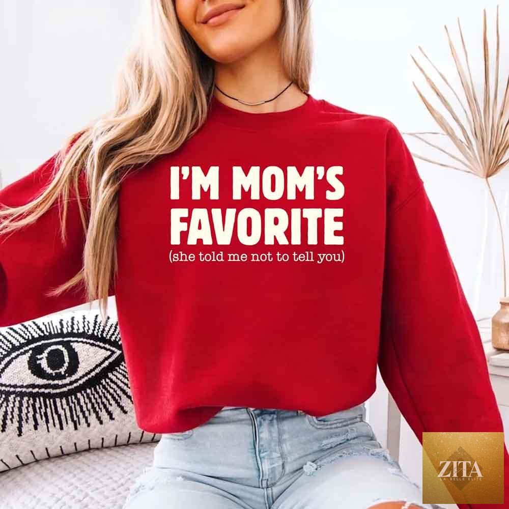 Unisex I’m Mom’s Favorite sweatshirt by Adorb Custom Tees, featuring humorous text for son and daughter in cozy fabric.
